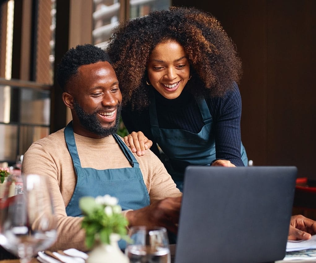 Couple looking at a laptop