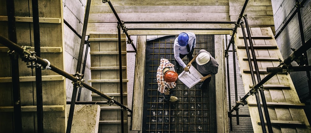 Architect, engineer and foreman on a construction site