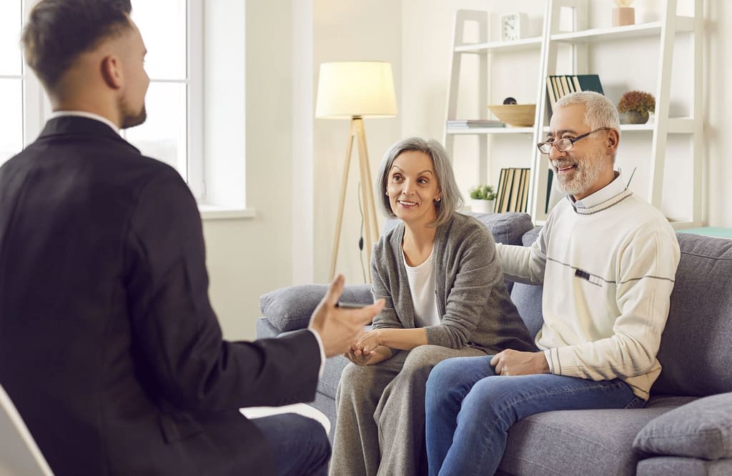 couple talking to agent in Milton, FL