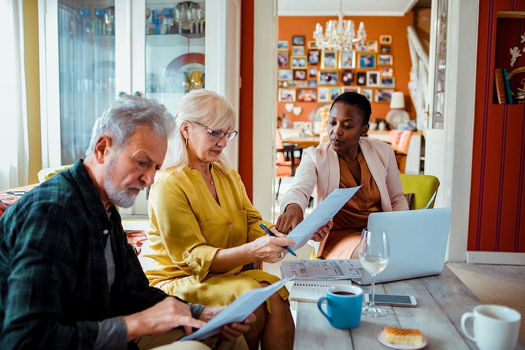 Jay, FL couple reviewing papers with agent