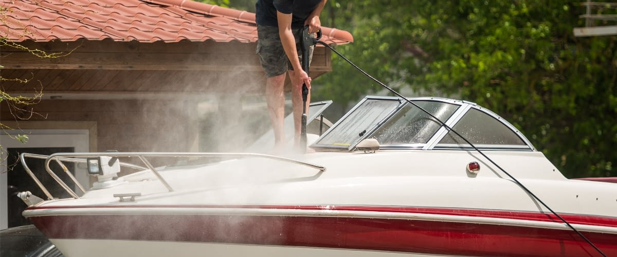 Close-up of man cleaning boat.