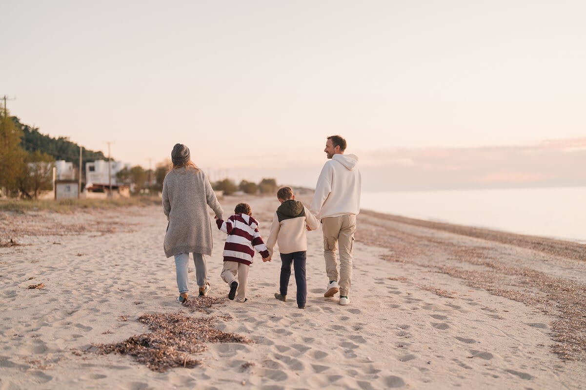 family-walk-down-the-beach family walk down the beach
