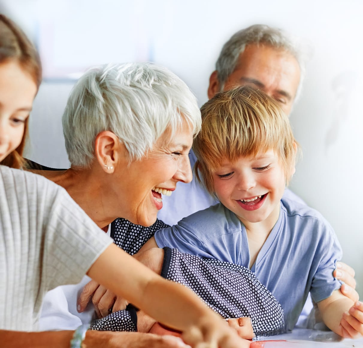 family of four laughing