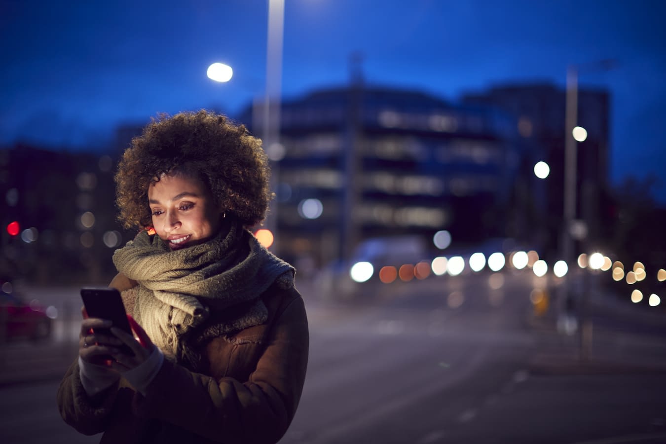 Woman outside in the cold Woman in the cold on the phone