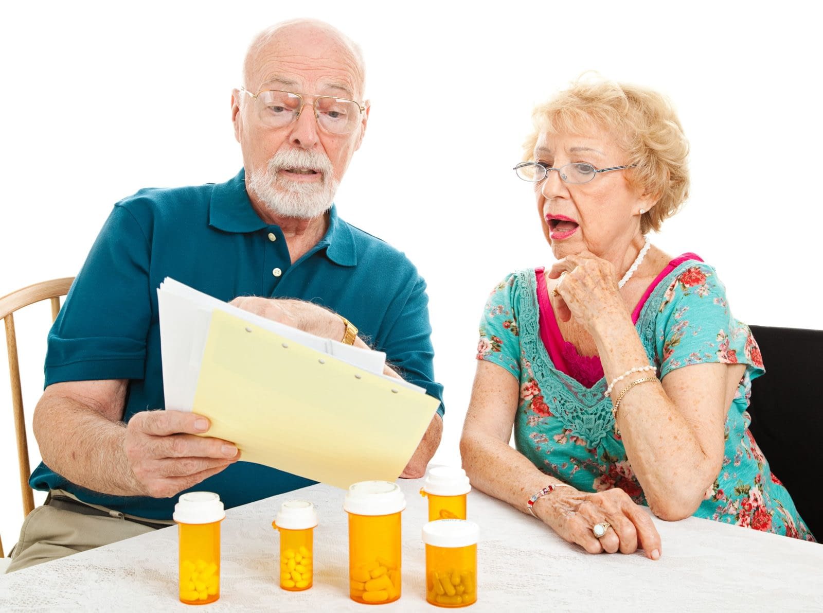 Shocking Cost of Medical Care Senior couple shocked by the high cost of their medical bills. White background.