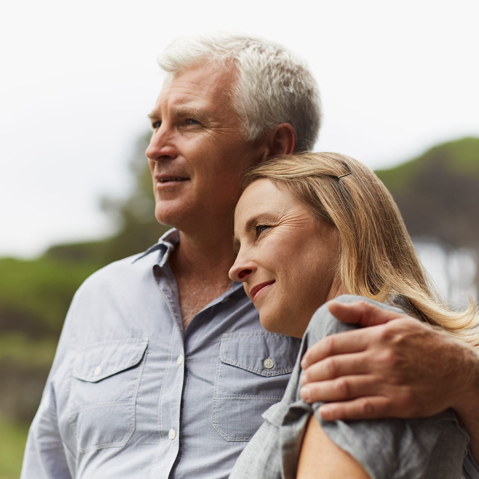 Older couple looking outside