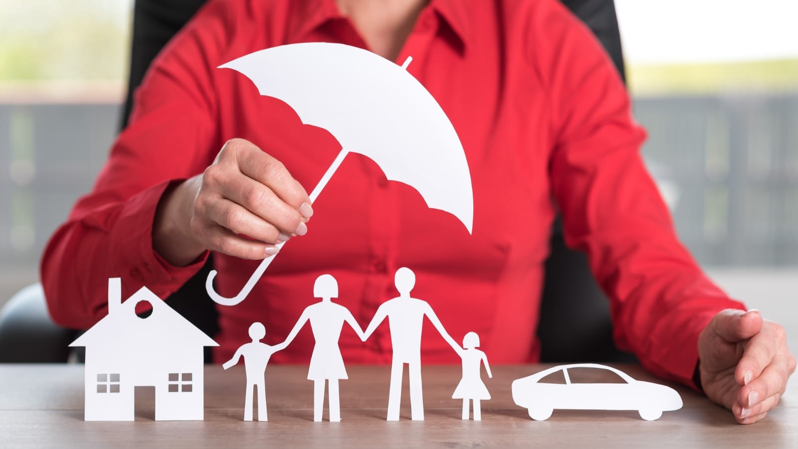 umbrella covering a family, home, and vehicle
