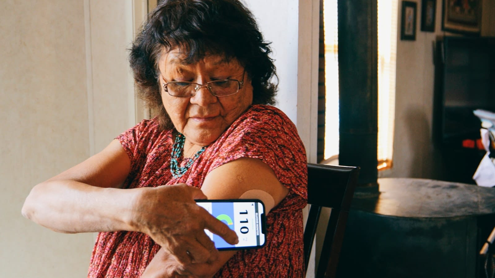 Elderly diabetic woman checking her blood sugar