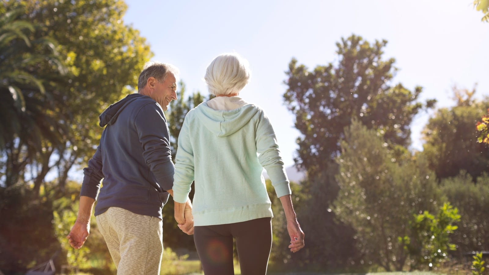 Senior couple taking walk outside together