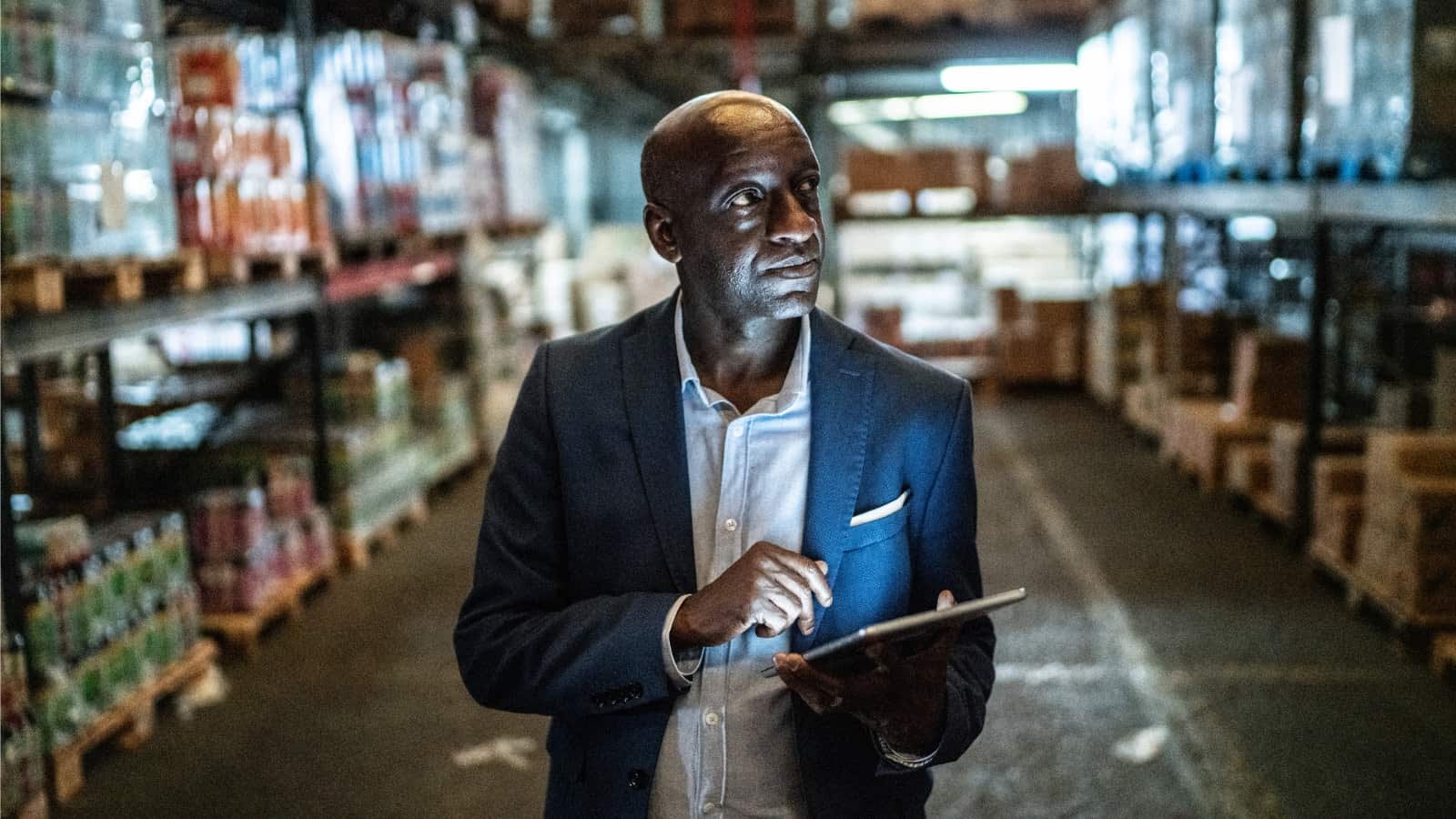 male African-American business owner doing inventory walk-through