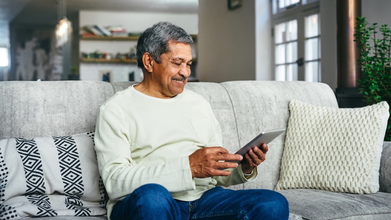 Nov 6 blog older man reading on iPad