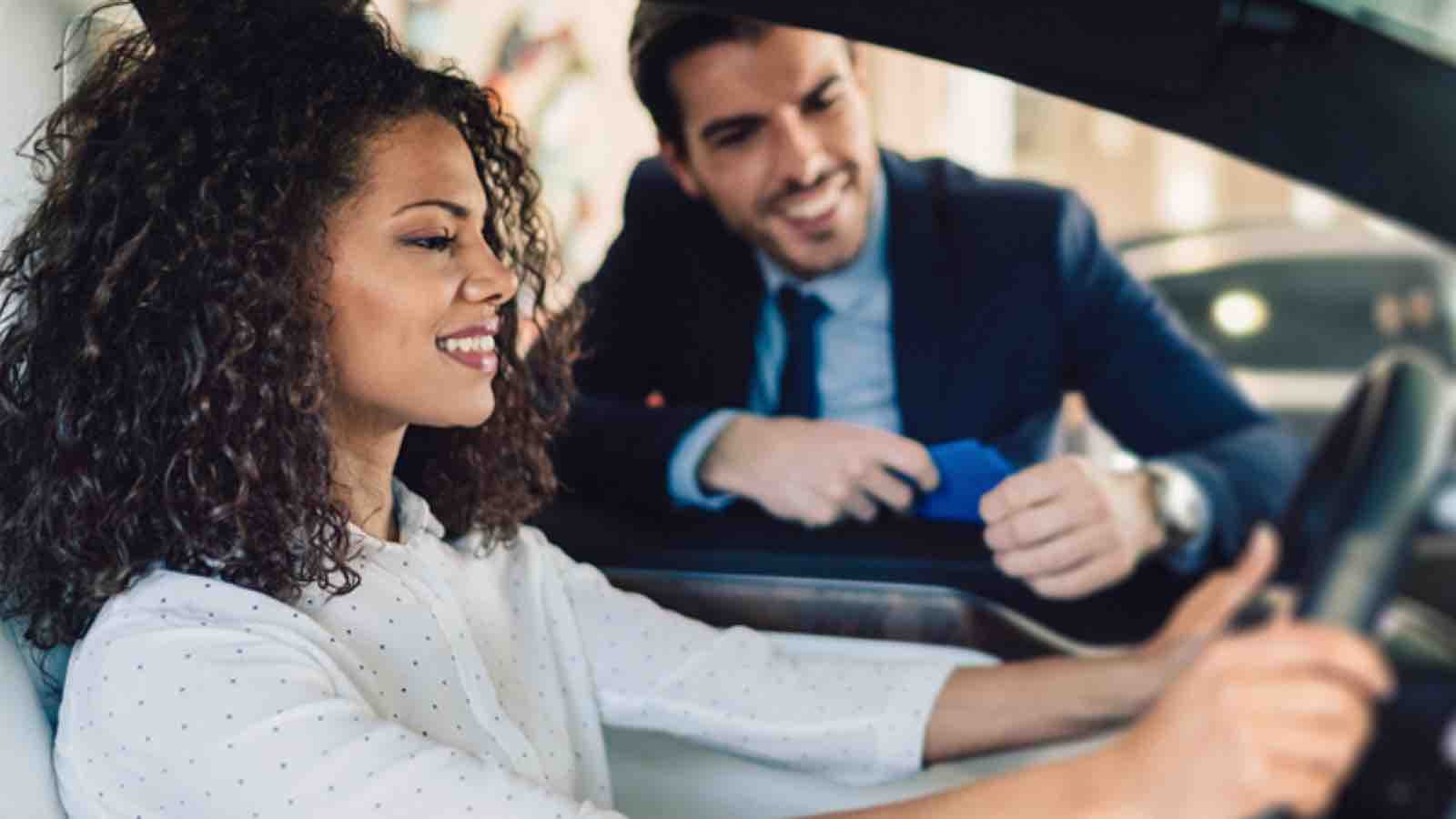 woman testing a new car