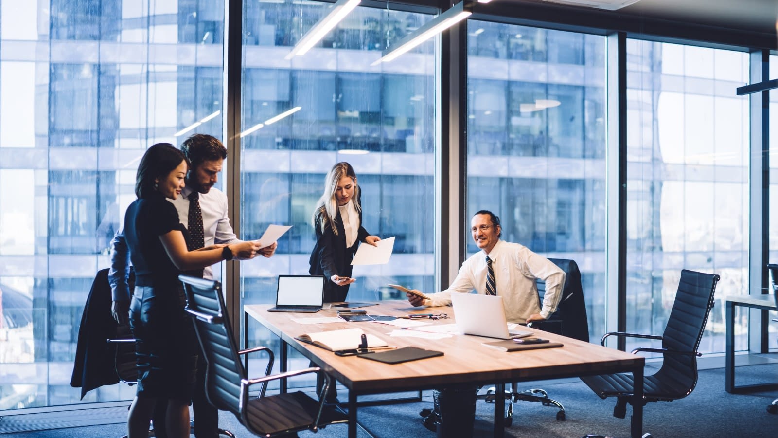 Co workers in the office Going over paperwork in the office