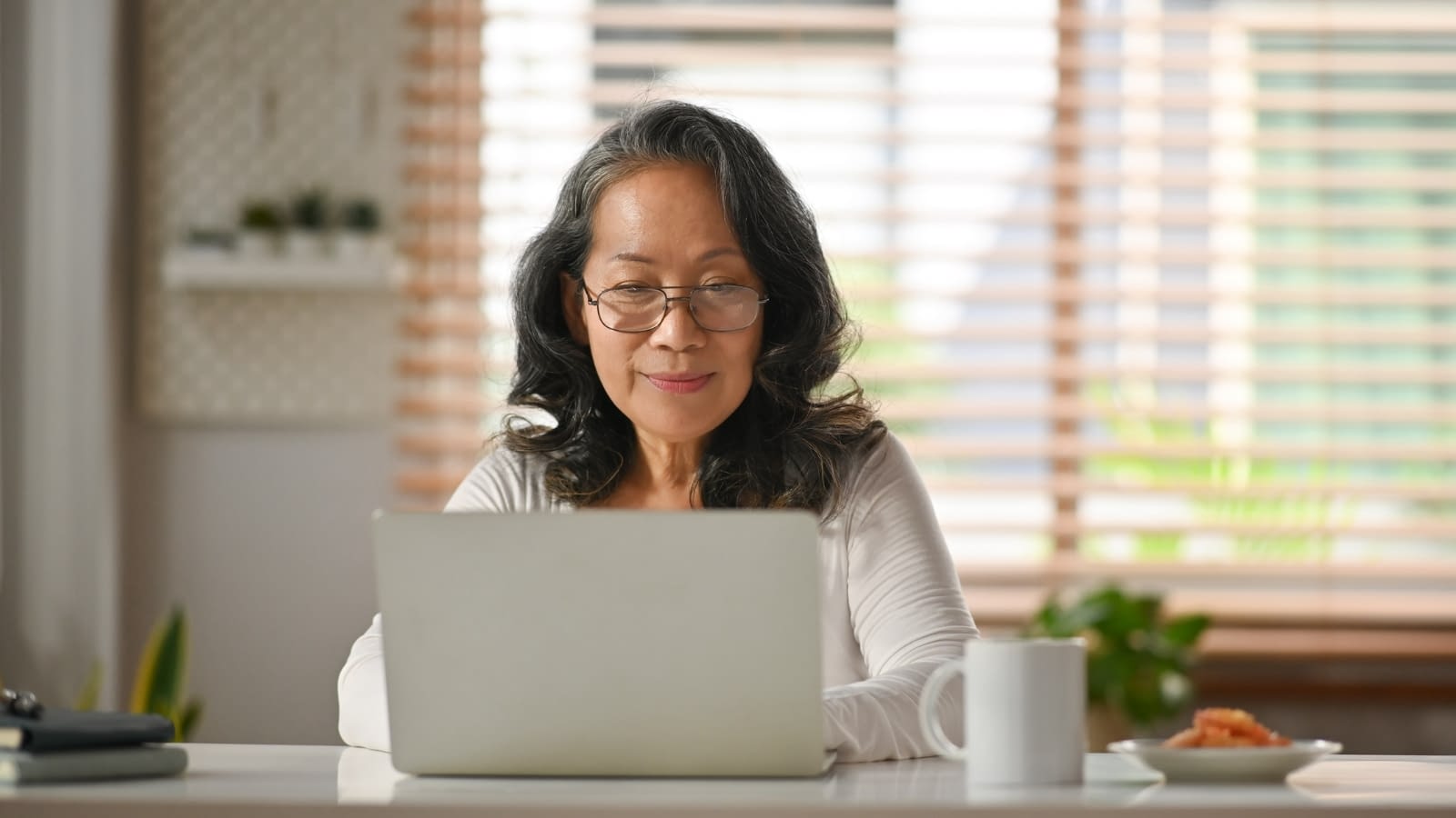 Feb 22 blog Woman reading on lap top