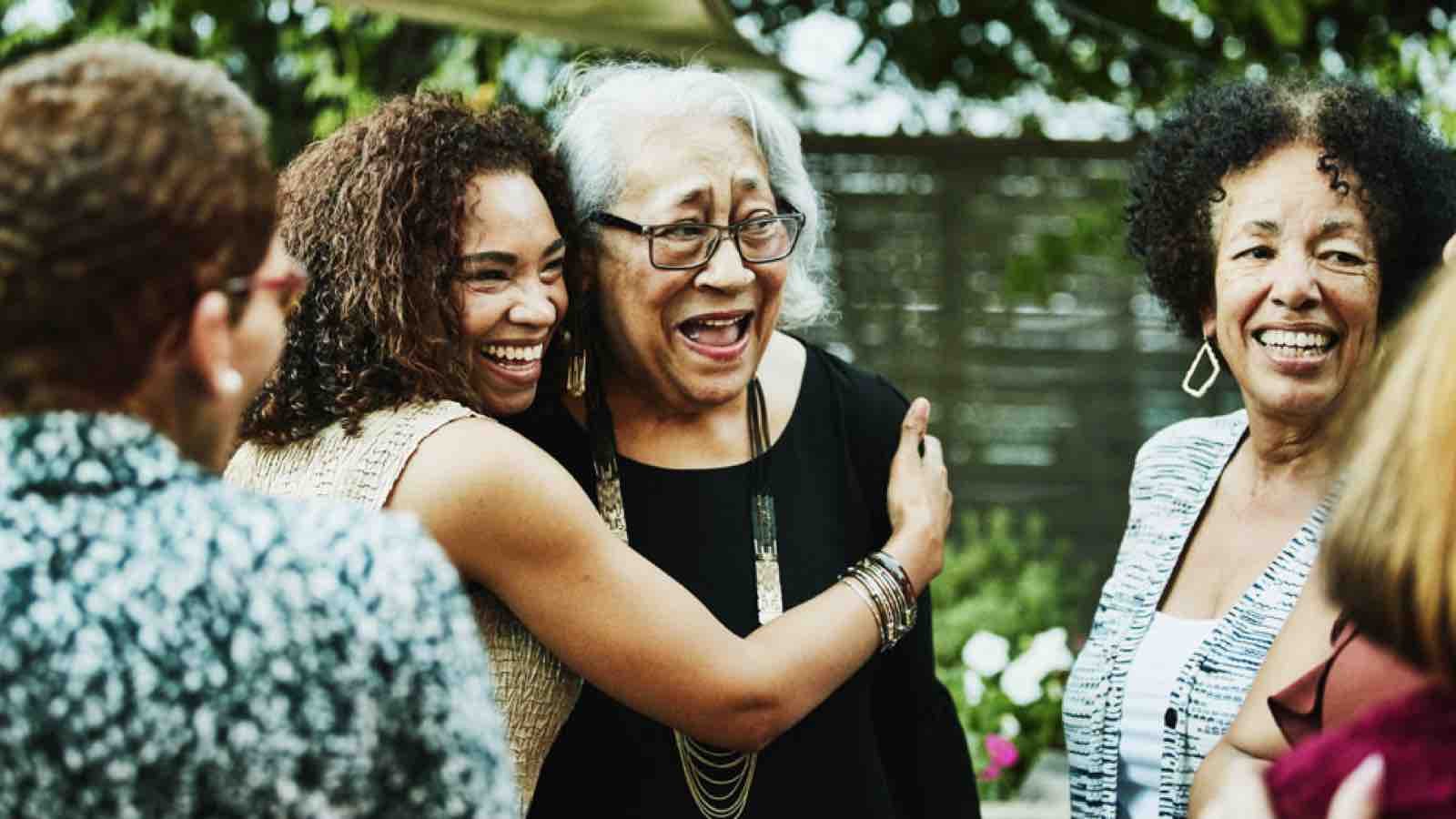 Young woman hugging grandma