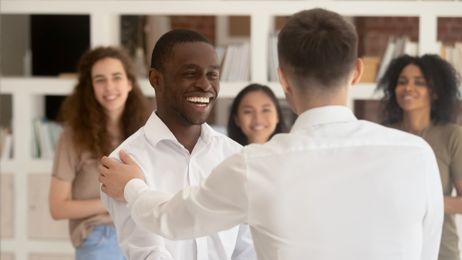 employees congratulating another employee