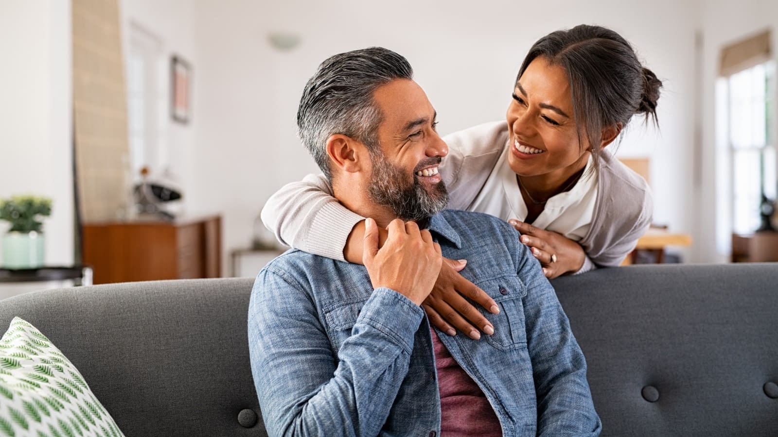 Happy diverse couple Couple smiling at each other