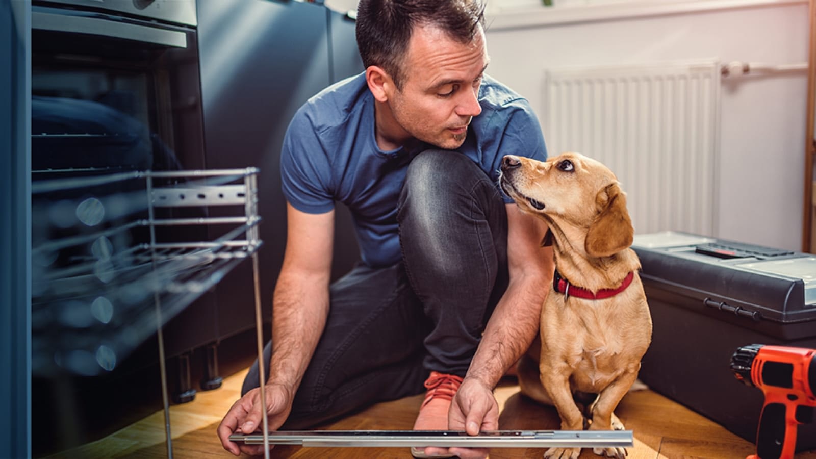 Man working on a home project for his dog