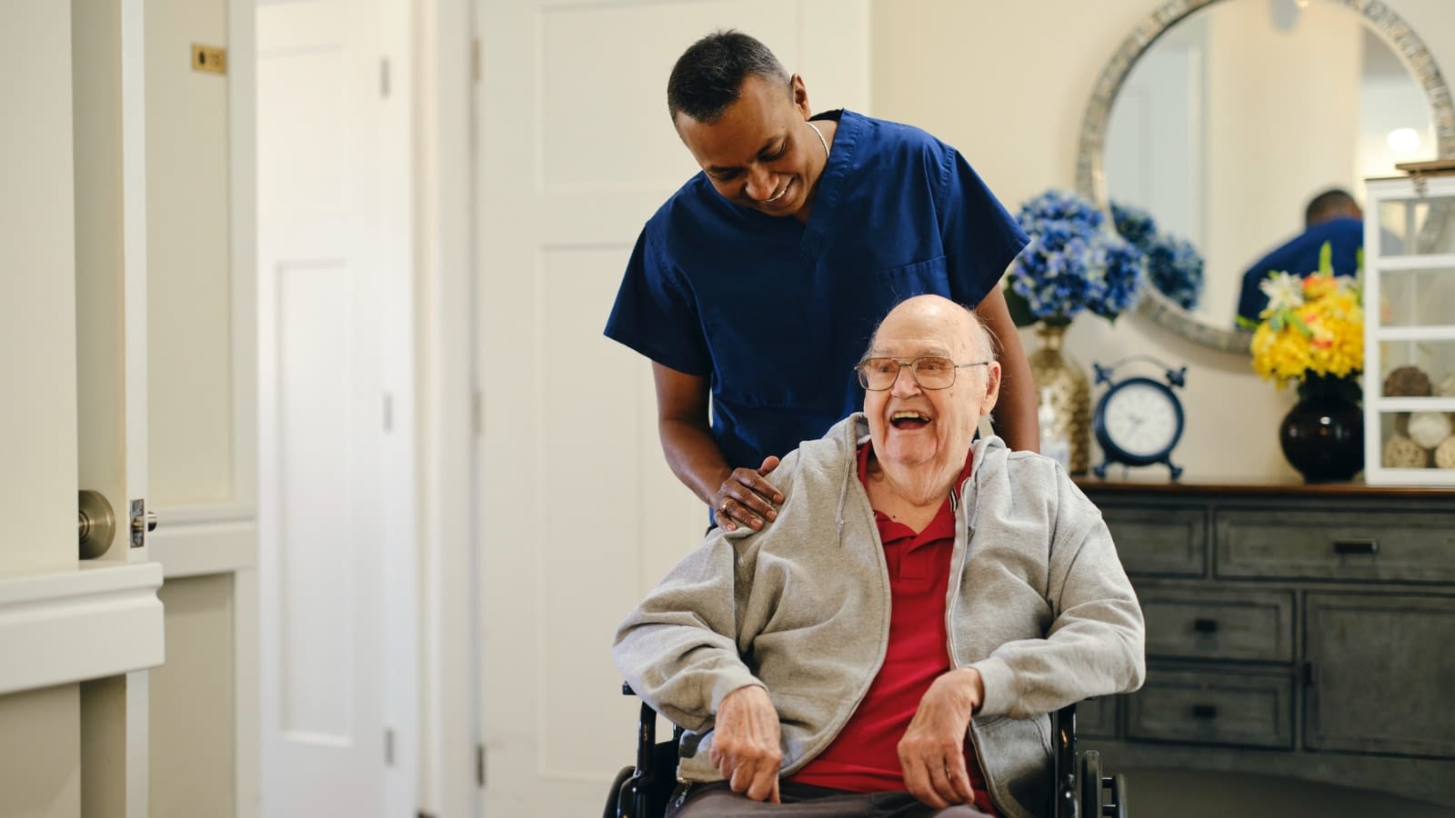 Dec 6 blog hospice care worker helping older man in wheelchair