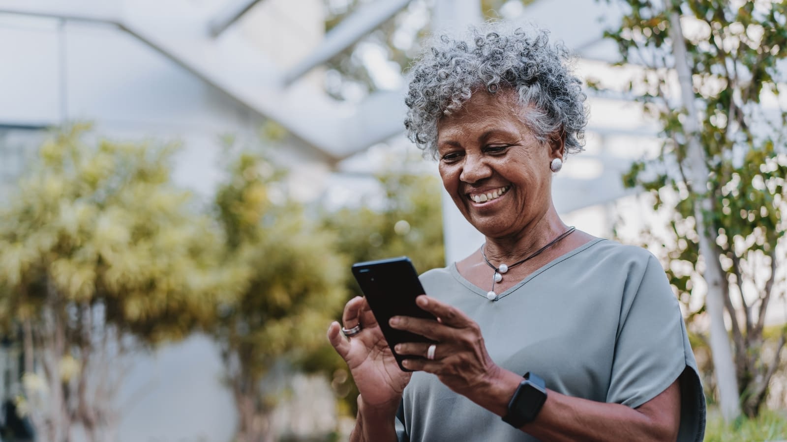 March 21 blog Senior female smiling texting on phone