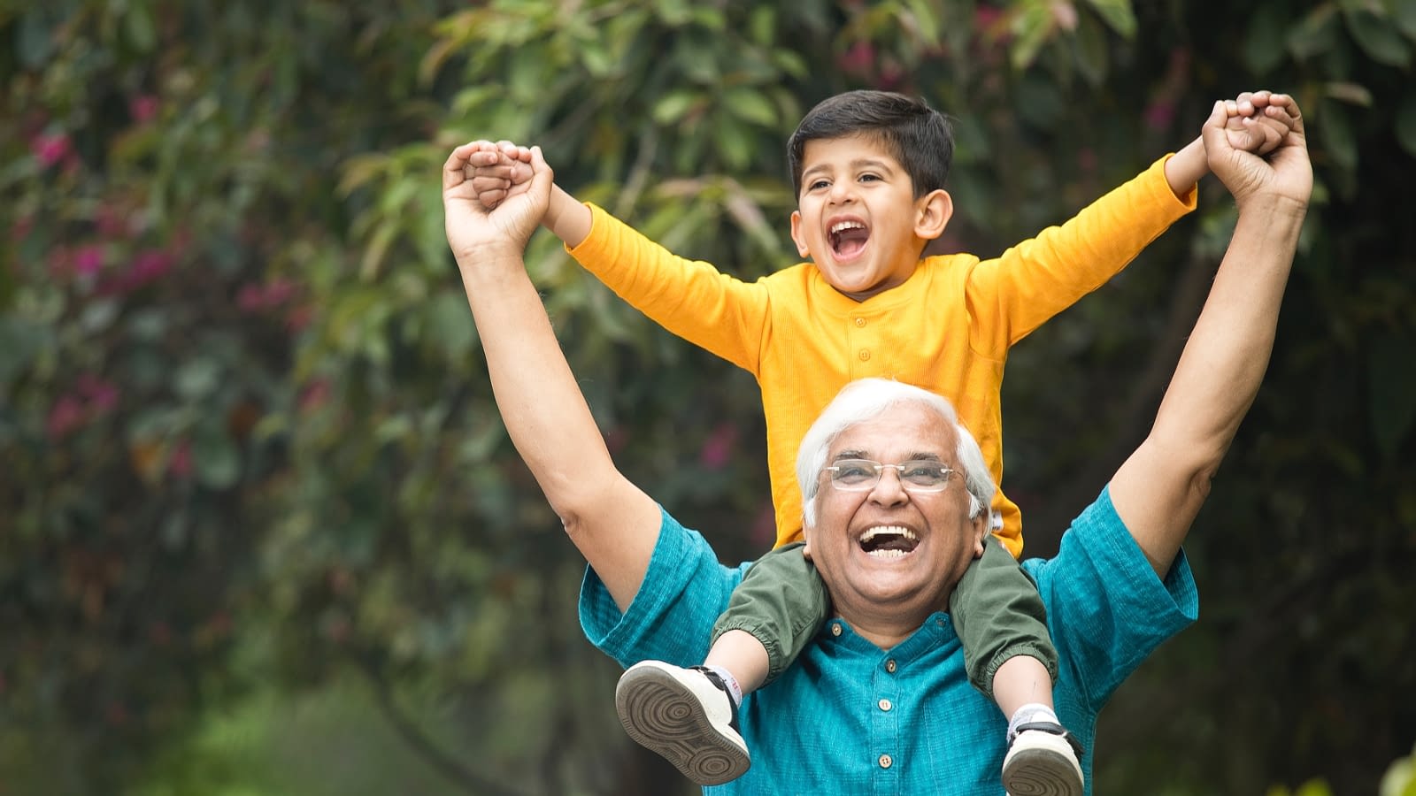 long-term care insurance grandson on grandfather's shoulders