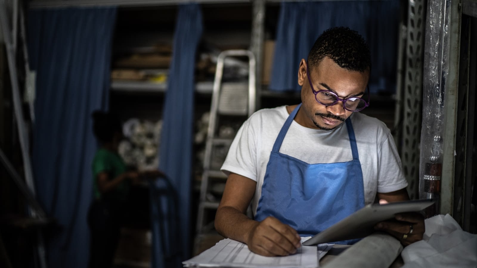 May 19 blog Male business owner doing paperwork.