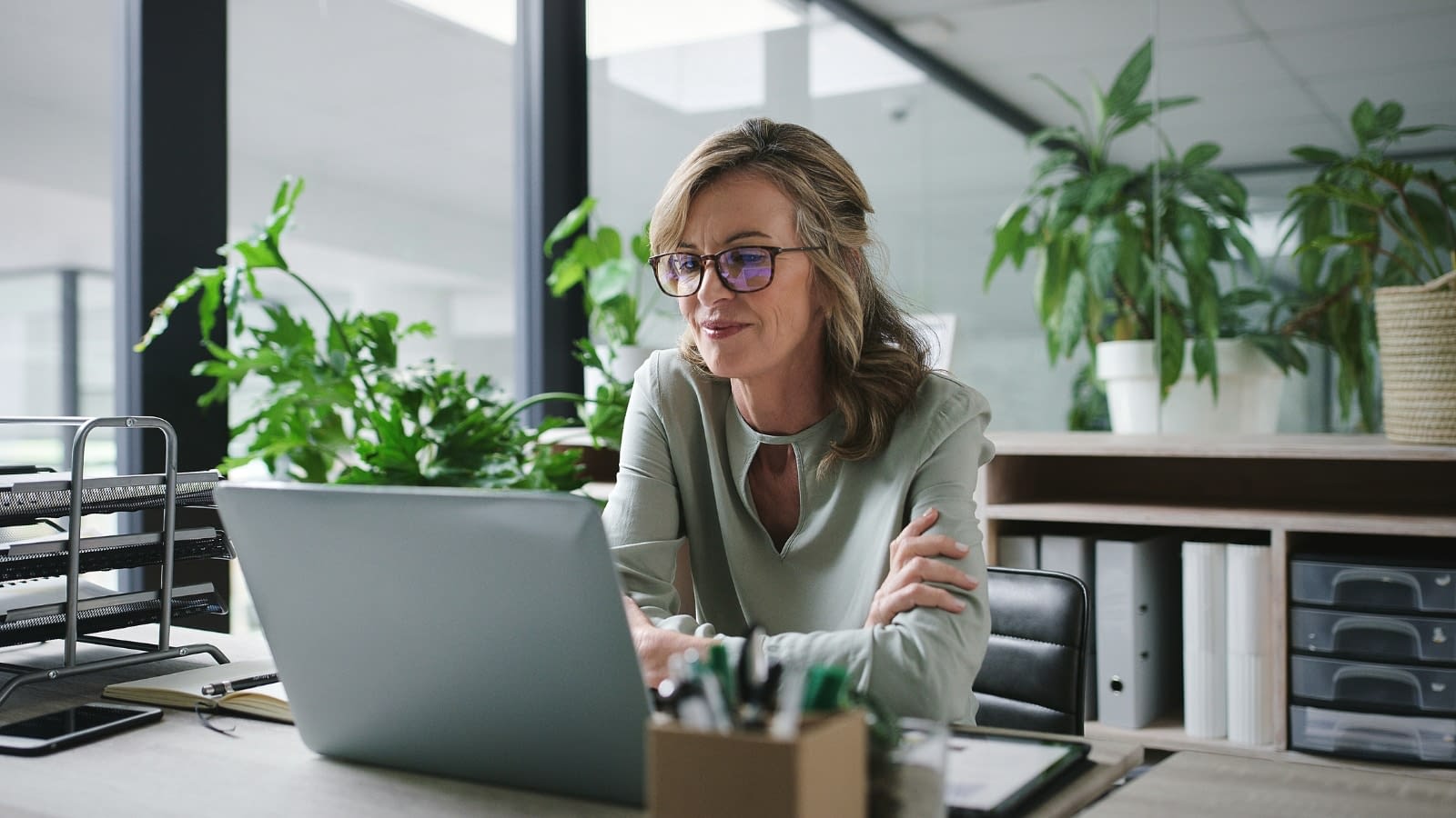 May 4 blog Older female business owner reading on laptop