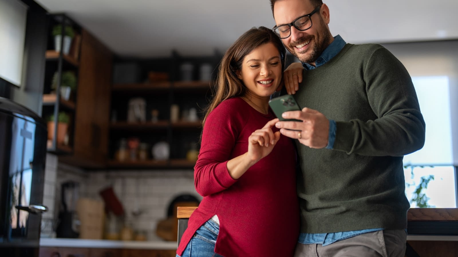 May 7 blog Pregnant couple looking at life insurance together