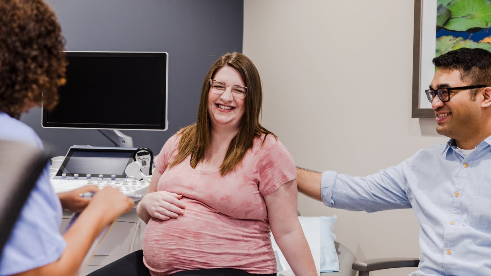August 10 blog Pregnant woman at doctor visit with her partner