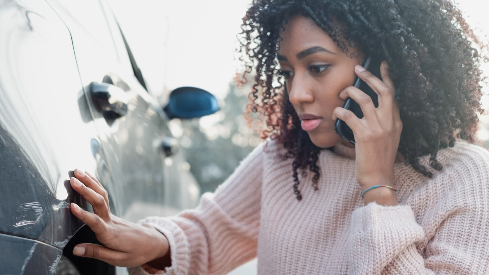 Car accident and black woman calling help Woman taking a phone call after accident