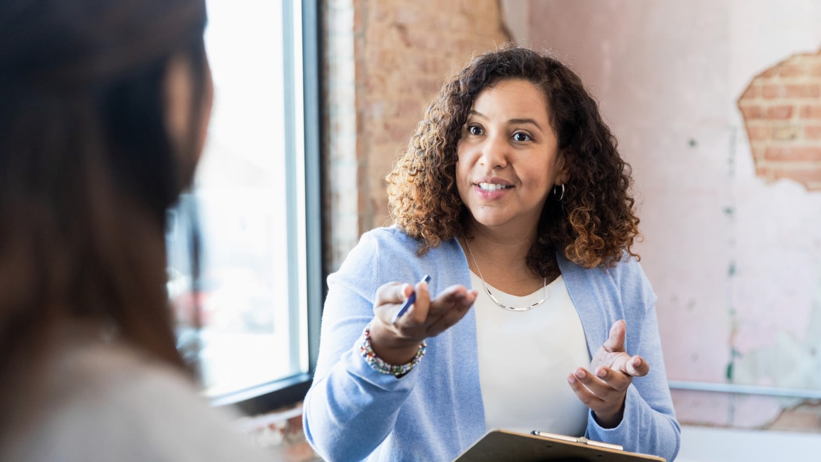 female leader speaking to employees