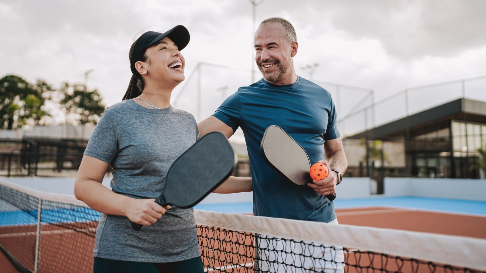 May 25 blog Healthy couple playing pickleball.