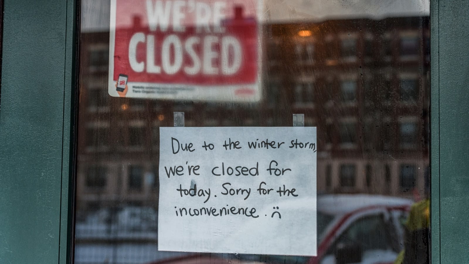 Dec 4 blog close-up of sign on shop window saying closed due to weather