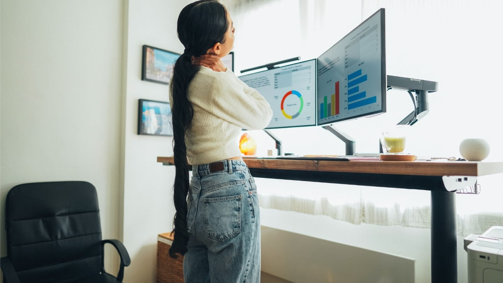 April 28 blog Millennial female standing at desk working on computers