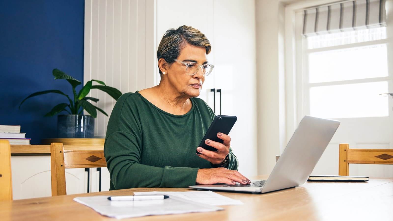 Feb 21 blog Elderly woman reading on phone