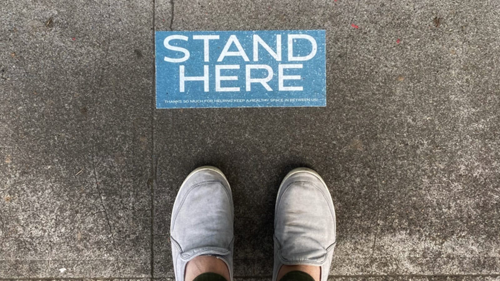 Stand Here sign