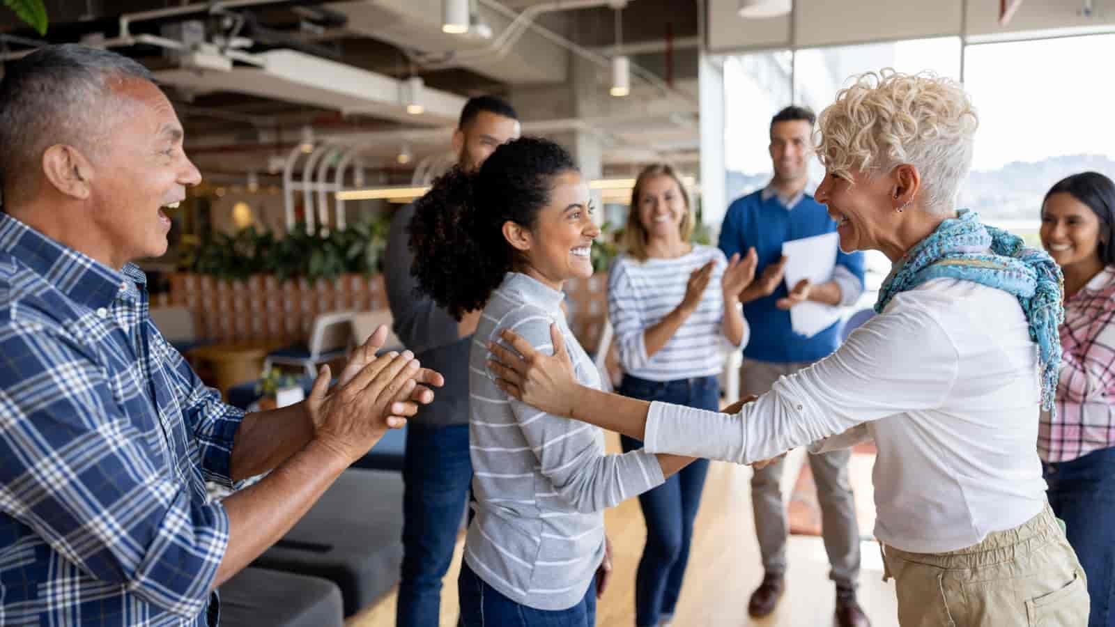 September 28th Blog Multi-cultural office congratulating female employee