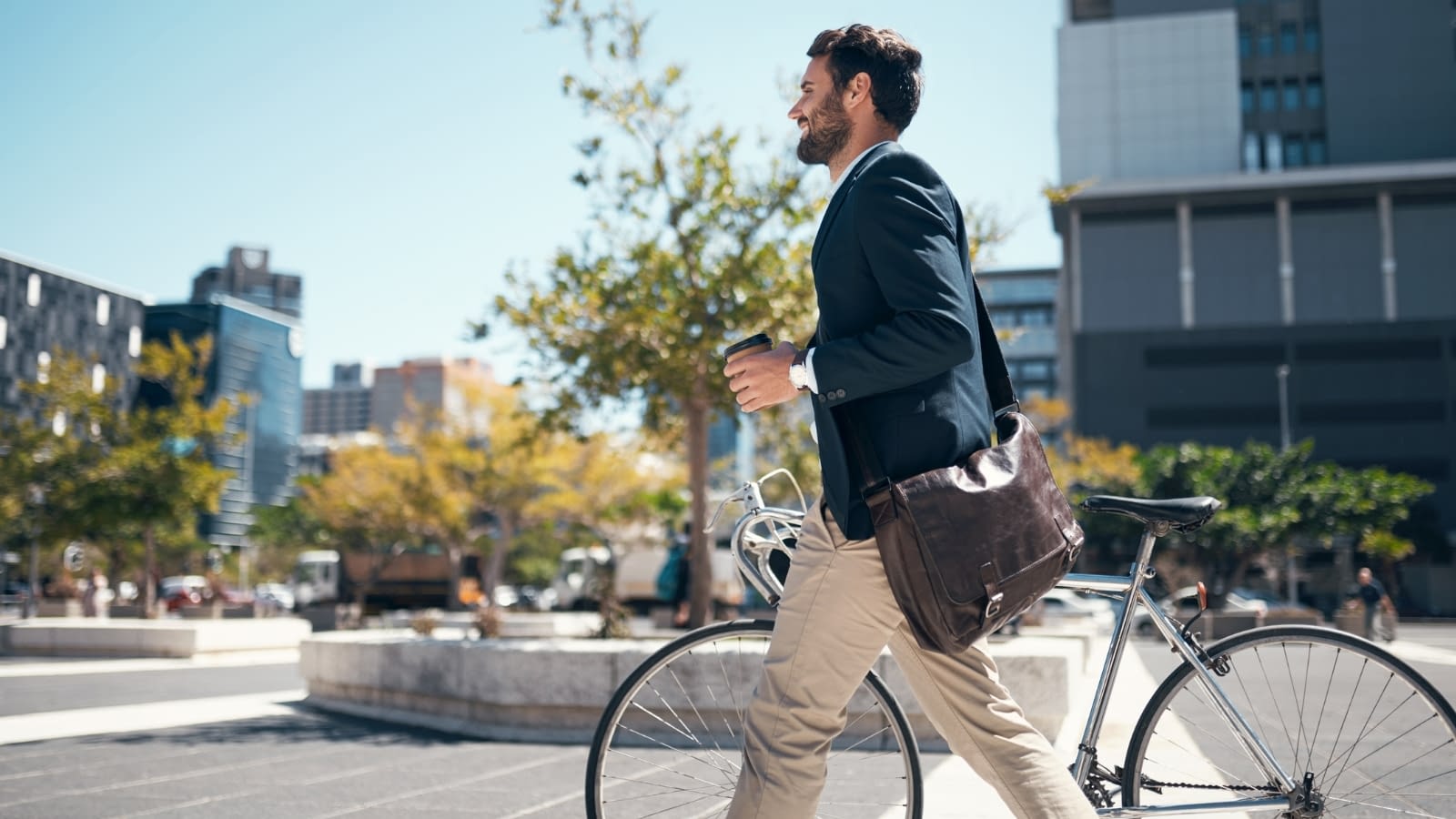 healthy habits businessman walking with bike
