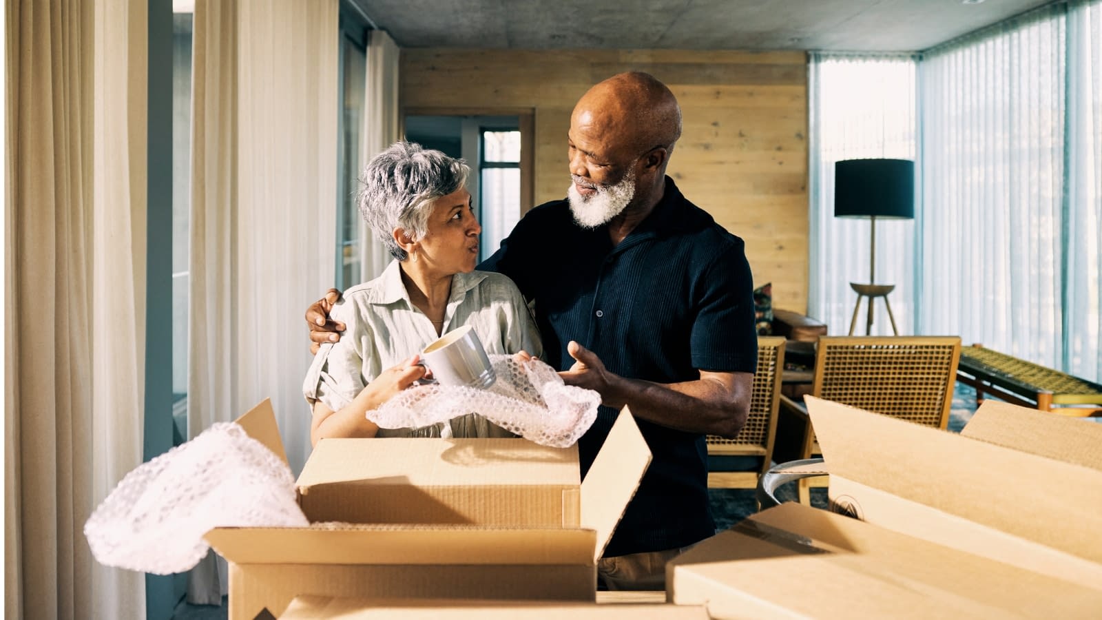 May 21 blog Senior couple packing up boxes to move.