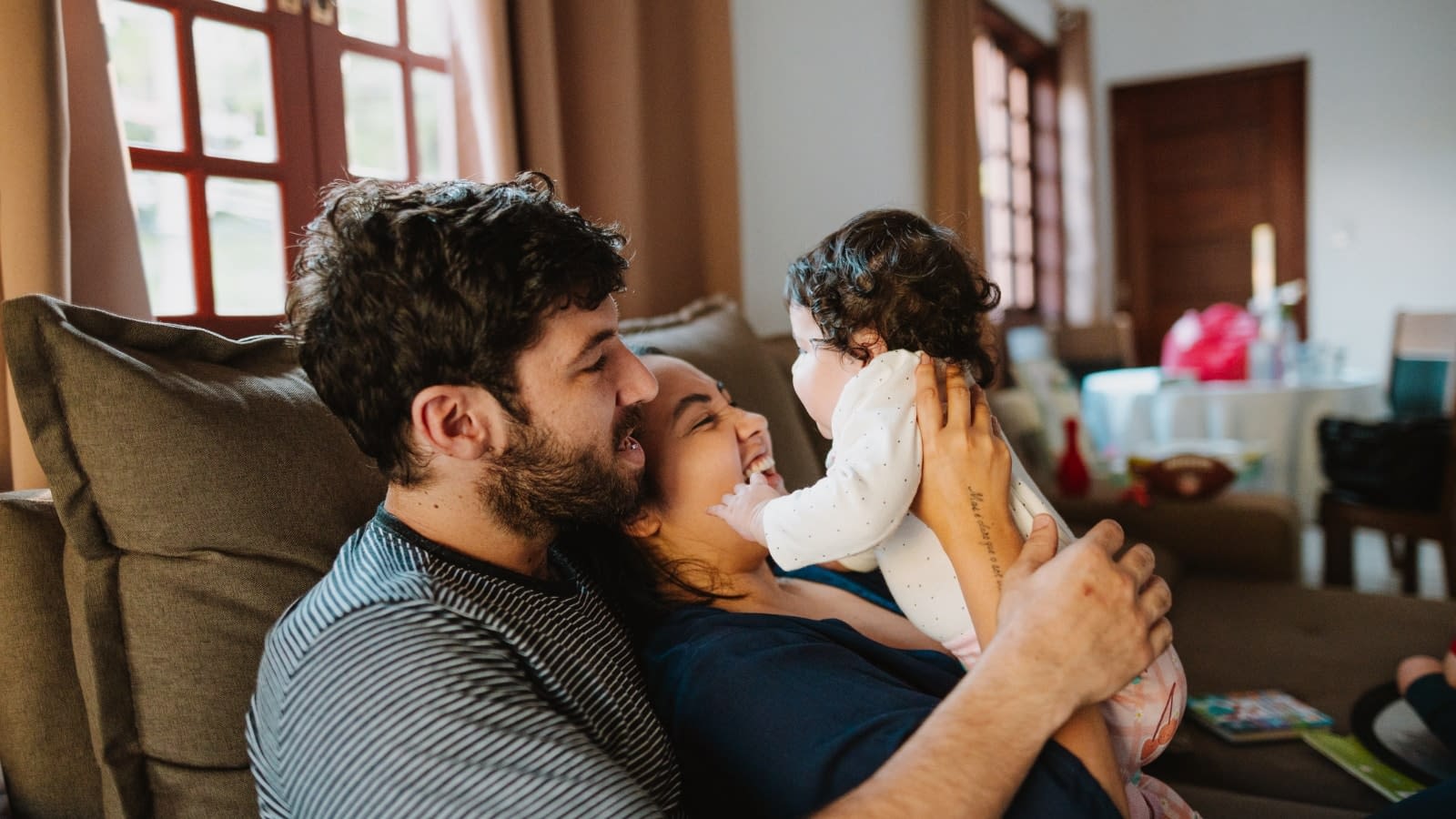 June 7 blog Couple sitting on couch with their baby