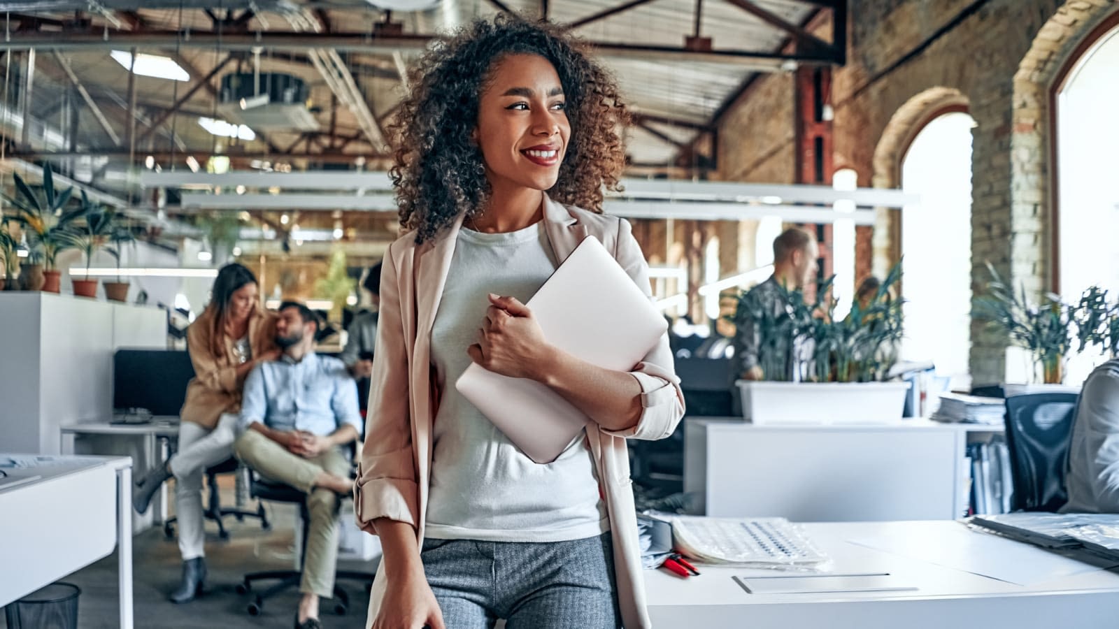 The Ins and Outs of Business Contents Insurance African American woman walking inside her business building
