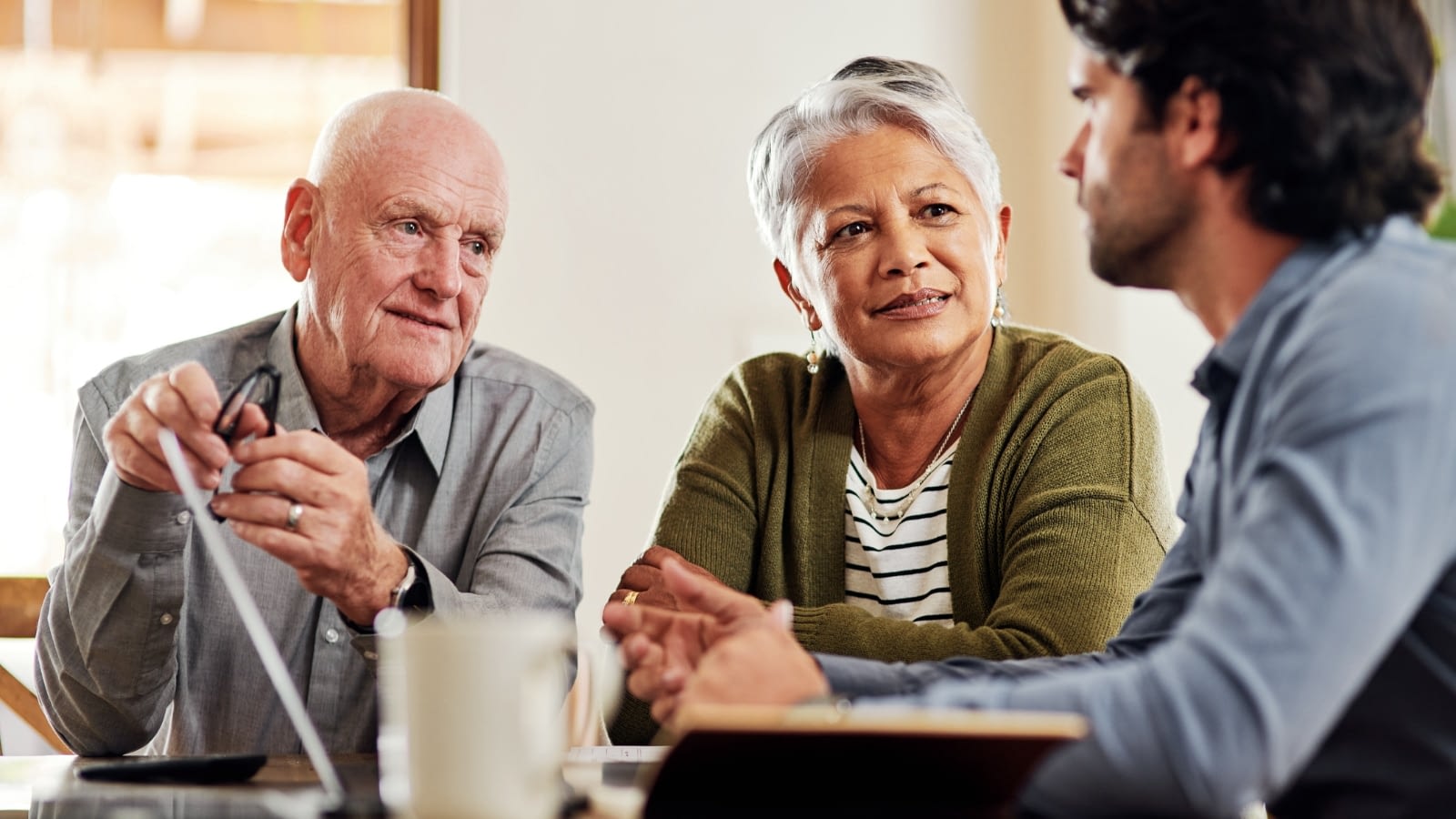 Senior couple discussing medicare options with an agent