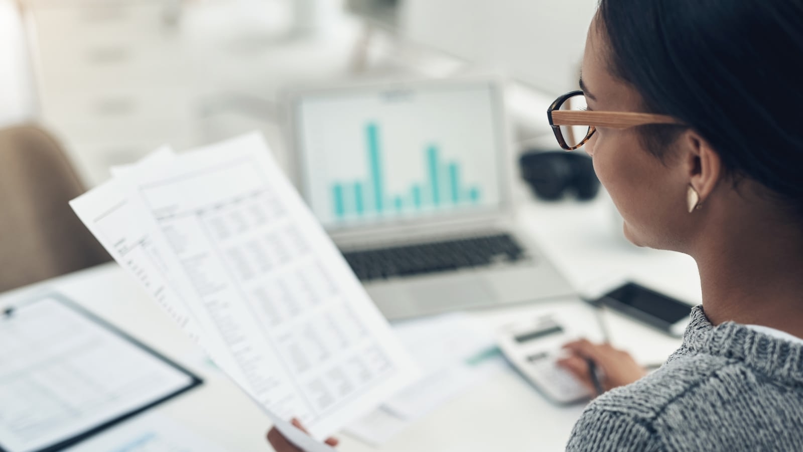 businesswoman reviewing financial documents