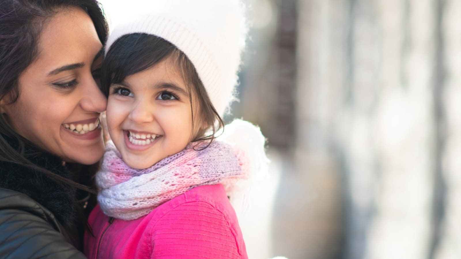Dec 7 blog young mom holding and kissing toddler aged daughter on cheek