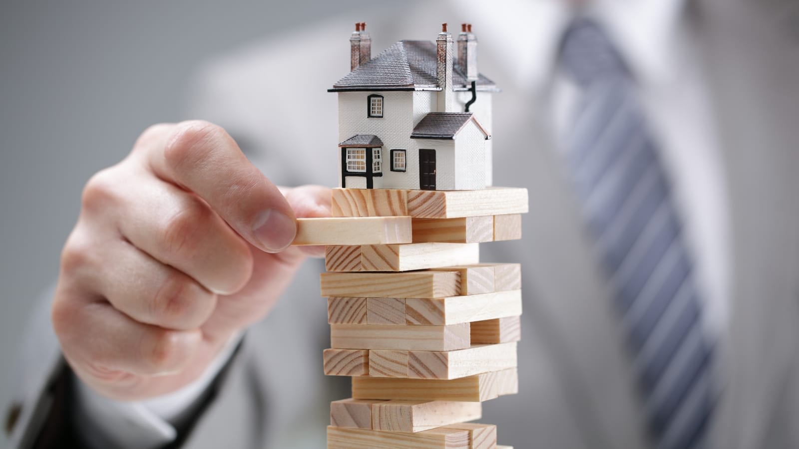 House atop jenga blocks