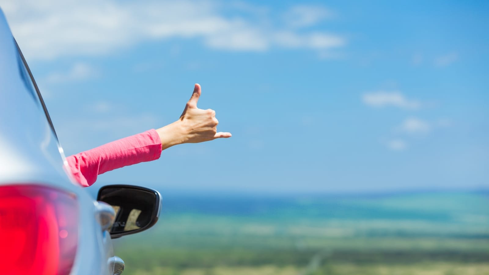 Happy person riding in a car