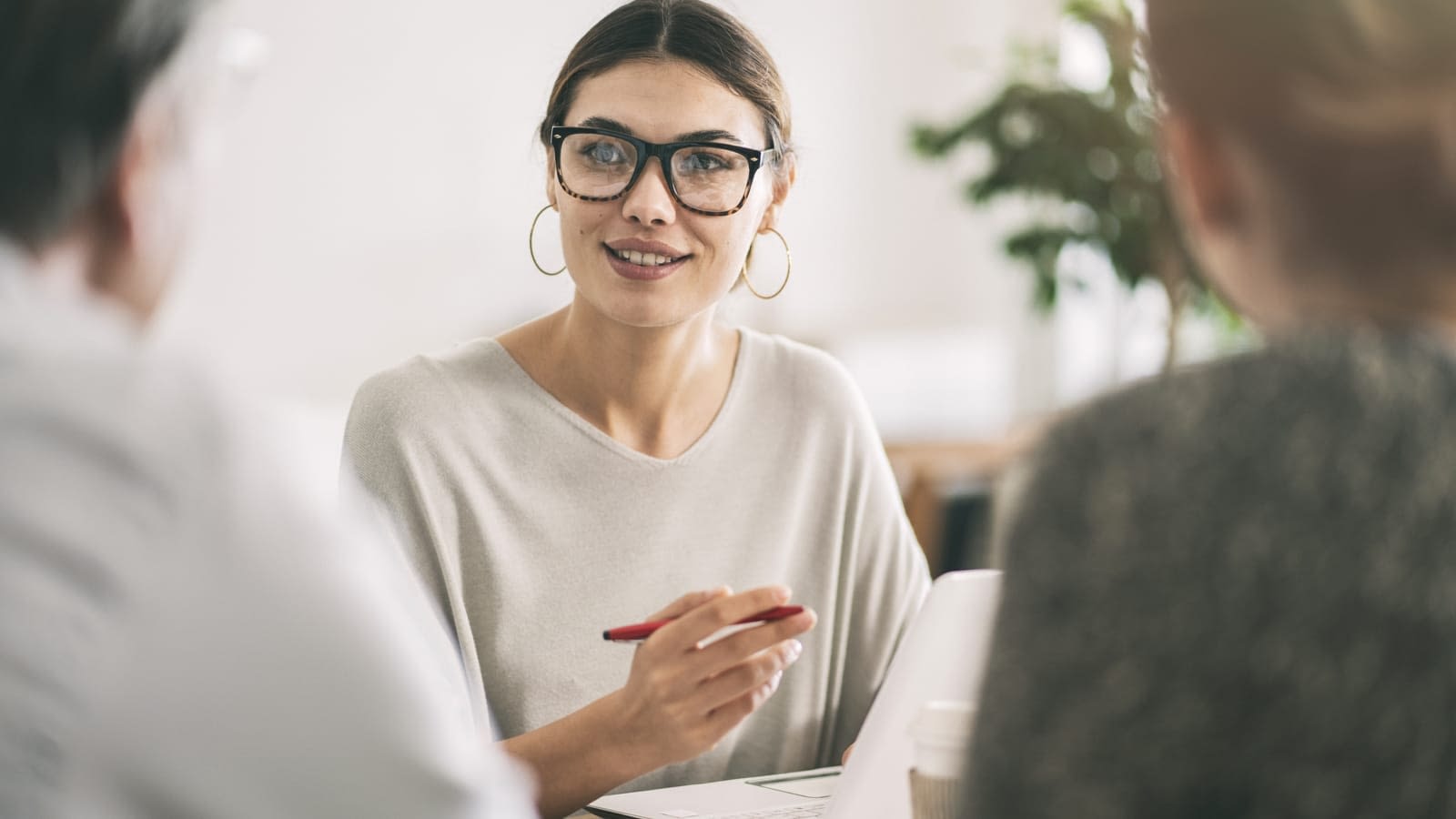 Young Insurance Agent Young insurance agent talking to clients