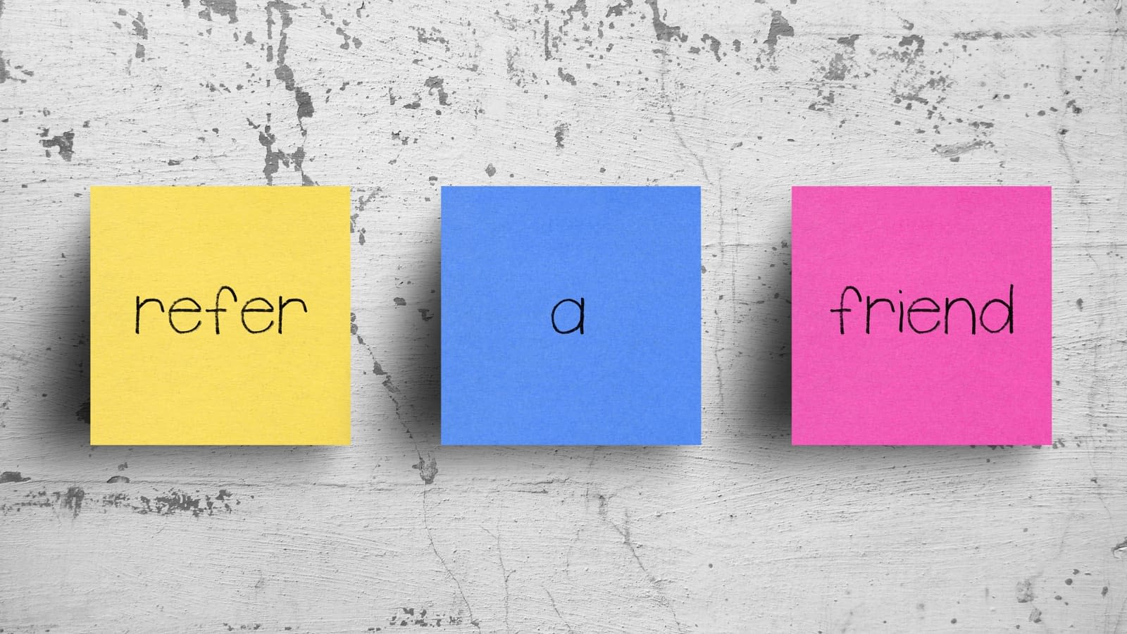 Refer A Friend Sticky notes spelling out Refer A Friend