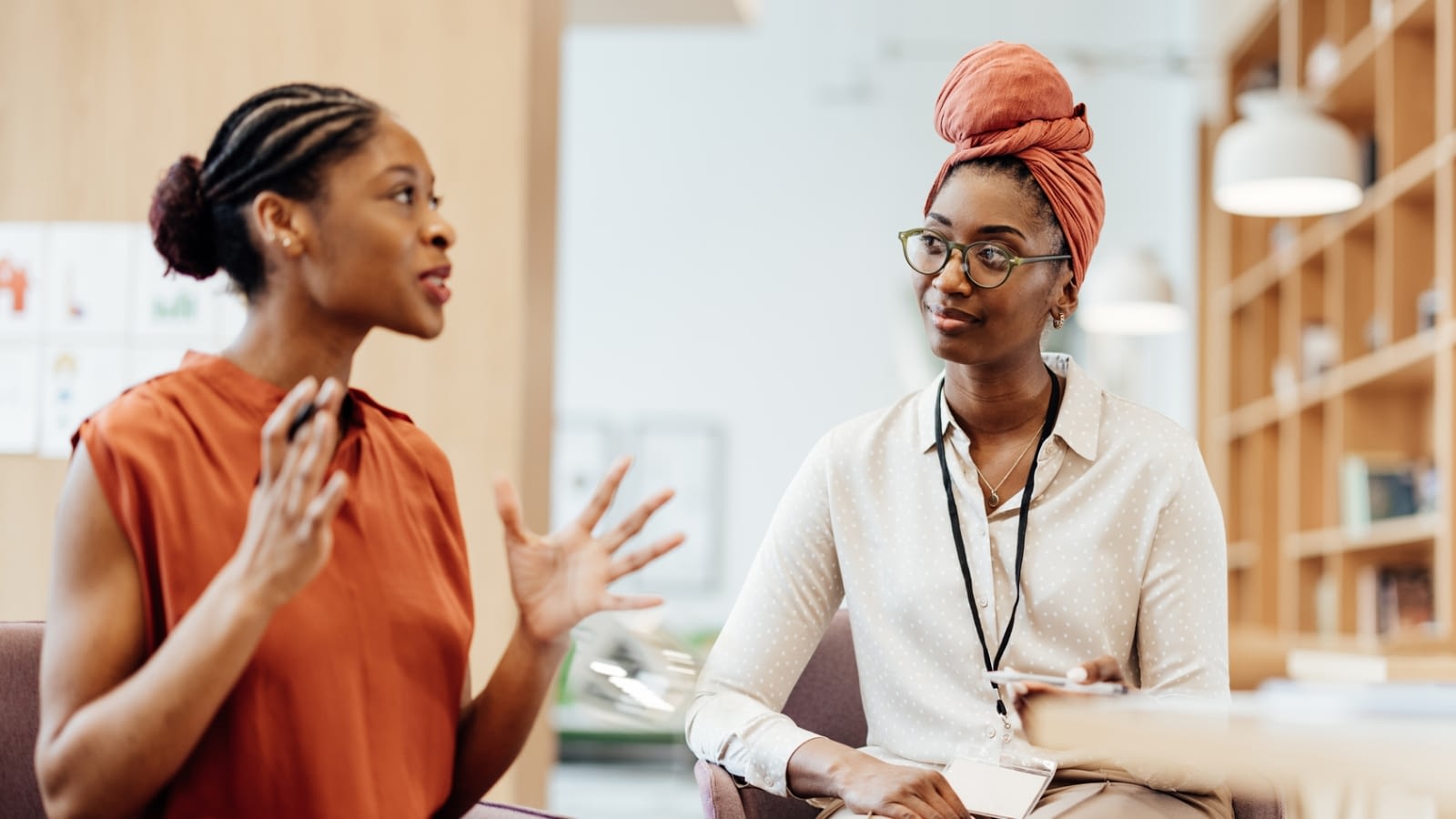 two business women talking at work