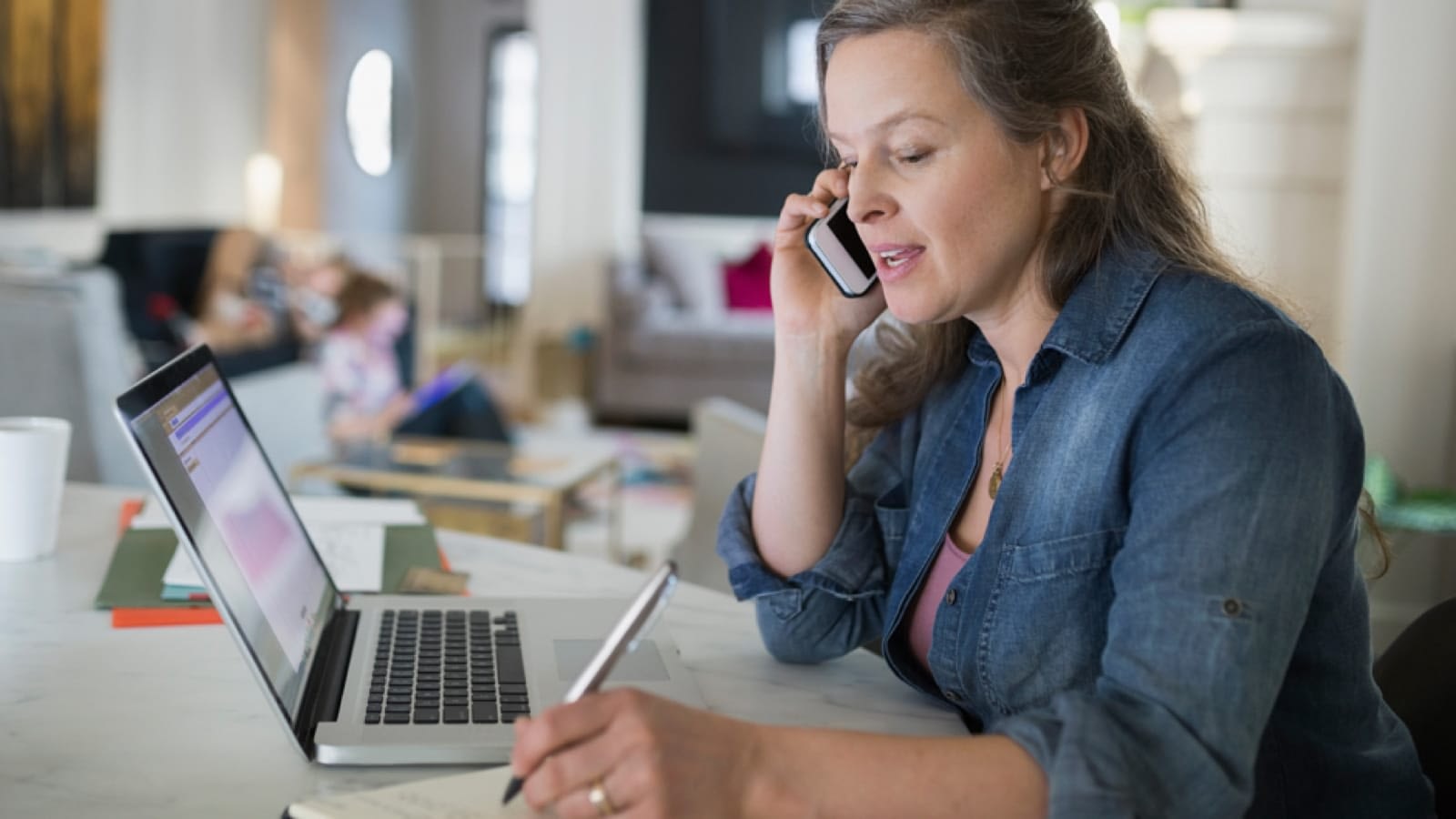 Woman talking on the phone at home